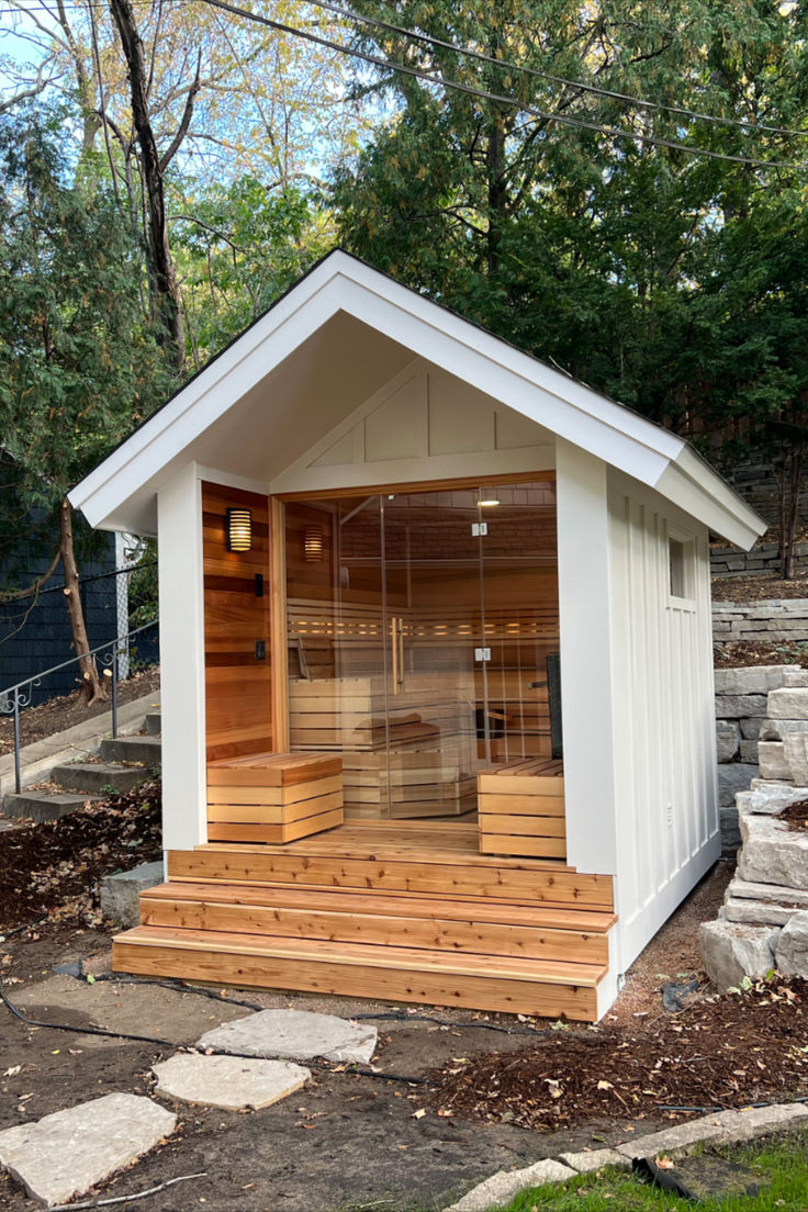 an outdoor sauna with steps leading up to it