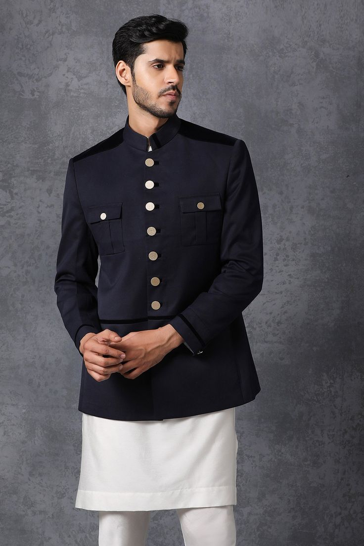 Dark blue bandhgala with front pockets detail.
Components: 1
Fabric: Suiting
Neckline: Band collar
Sleeve Length: Bracelet
Color: Blue
Lining material: Poly
Button placket on sleeve hems and pockets
Closure: Front button placket
Note: Kurta and pant worn by model are not for sale. - Aza Fashions Blue Bandhgala, Bandhgala For Men, Kurta With Pants, Band Collar, Not For Sale, Pocket Detail, Aza Fashion, Button Placket, Chef's Jackets