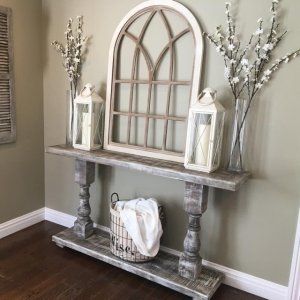 a shelf with some vases and candles on it