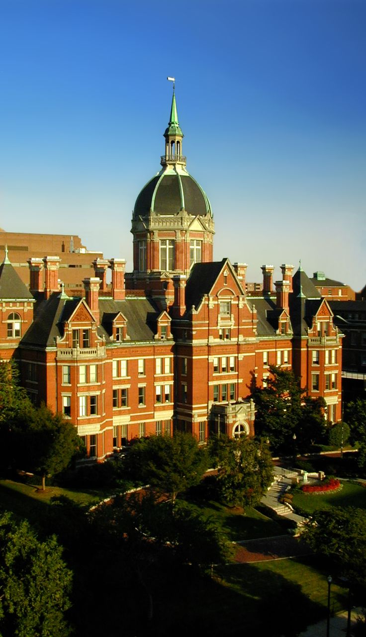 an old brick building with a dome on top