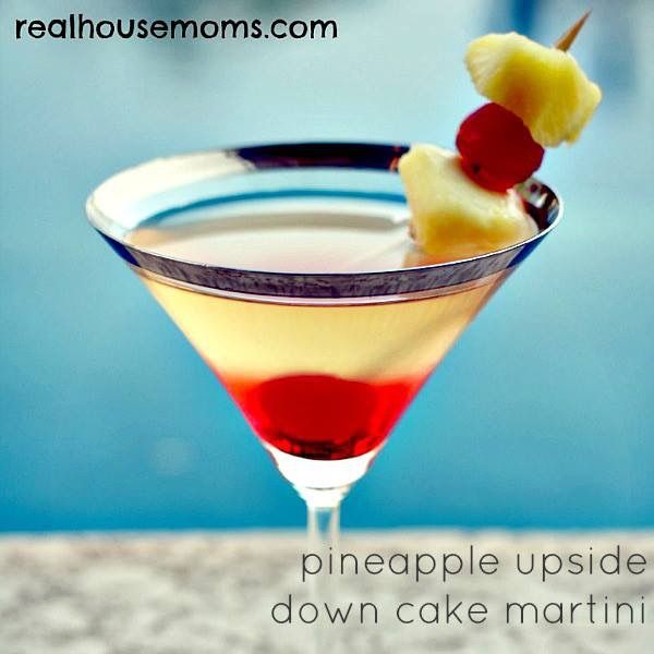 a martini with fruit garnish on the rim