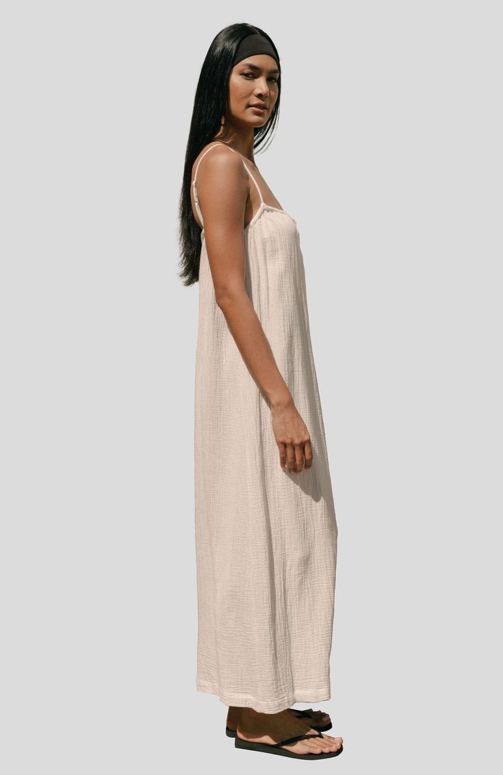 Feel elegant and care free in our Soleil Dress. This maxi dress features adjustable straps for the perfect fit, a tie front for a delicate touch, and a flowy design for a stunning silhouette. A must-have piece for any occasion.  Tie Front Adjustable Straps Maxi Length Flowy For best results wash on delicate cycle (or hand wash) on cold with eco detergent and lay flat or line dry. Summer Midi Dress With Adjustable Straps For Daywear, Flowy Maxi Dress With Spaghetti Straps For Daywear, Beach Midi Slip Dress With Adjustable Straps, Beach Slip Dress With Tie Straps, Flowy Midi Dress With Spaghetti Straps, Spring Beige Slip Dress With Adjustable Straps, Breezy Maxi Sundress With Adjustable Straps, Summer Beach Maxi Dress With Delicate Straps, Breezy Maxi Dress With Adjustable Straps