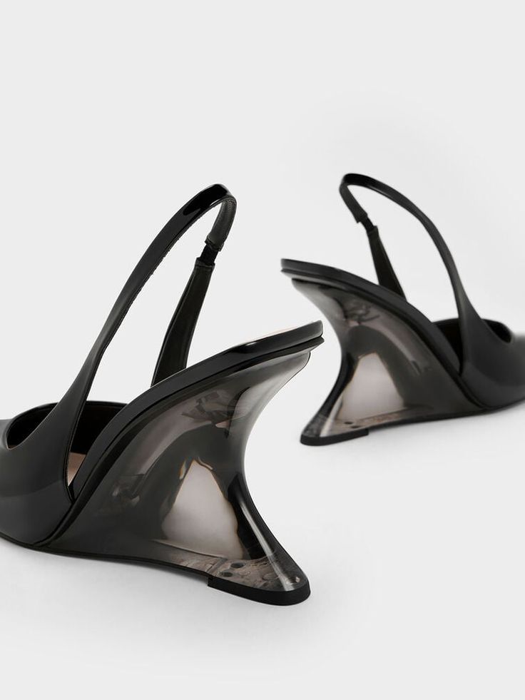 A modern twist on a classic, these slingback pumps come with stunning sculptural heels that will turn heads wherever you go. To top it off, these wedge heels have an eye-catching see-through design. The pointed-toed silhouette keeps these shoes looking sleek and polished, while the black patent finish exude a glossy shine. Wear them with a classy shirt dress for an effortlessly chic desk-to-dinner look. Classy Shirt Dress, Dress Down Day, Faux Leather Heels, Size Chart For Kids, Charles Keith, Black Wedges, Slingback Pump, Belt Size, Leather Heels