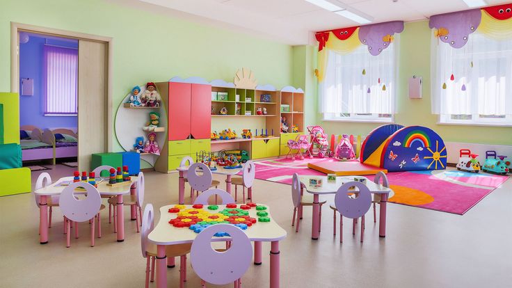 a child's playroom with lots of colorful furniture