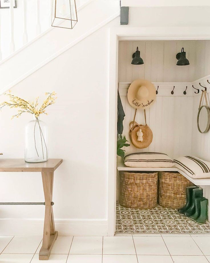 the entryway is clean and ready to be used as a storage area for shoes