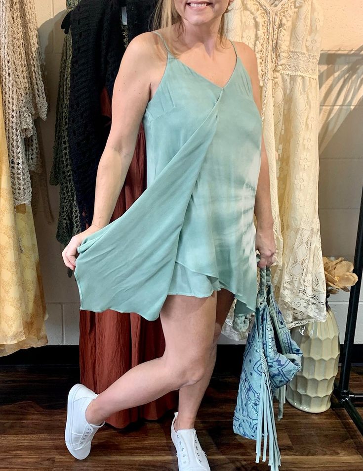 This dress is soft, light, and perfect for beach to the boardwalk, strolling through town, or any casual activities. Doubles as a cover-up too. Features a flowy layer, and tie-back straps for the perfect fit. True to size. Spring Vacation Slip Dress With Adjustable Straps, Adjustable Strap Slip Dress For Vacation In Spring, Spring Day Out Slip Dress With Adjustable Straps, Spring Summer Slip Dress With Adjustable Straps, Spring Slip Dress With Adjustable Straps, Spring Slip Dress With Adjustable Straps For Summer, Spring Slip Dress With Adjustable Straps For Day Out, Spaghetti Strap Beach Dress For Day Out, Beach Slip Dress With Tie Straps