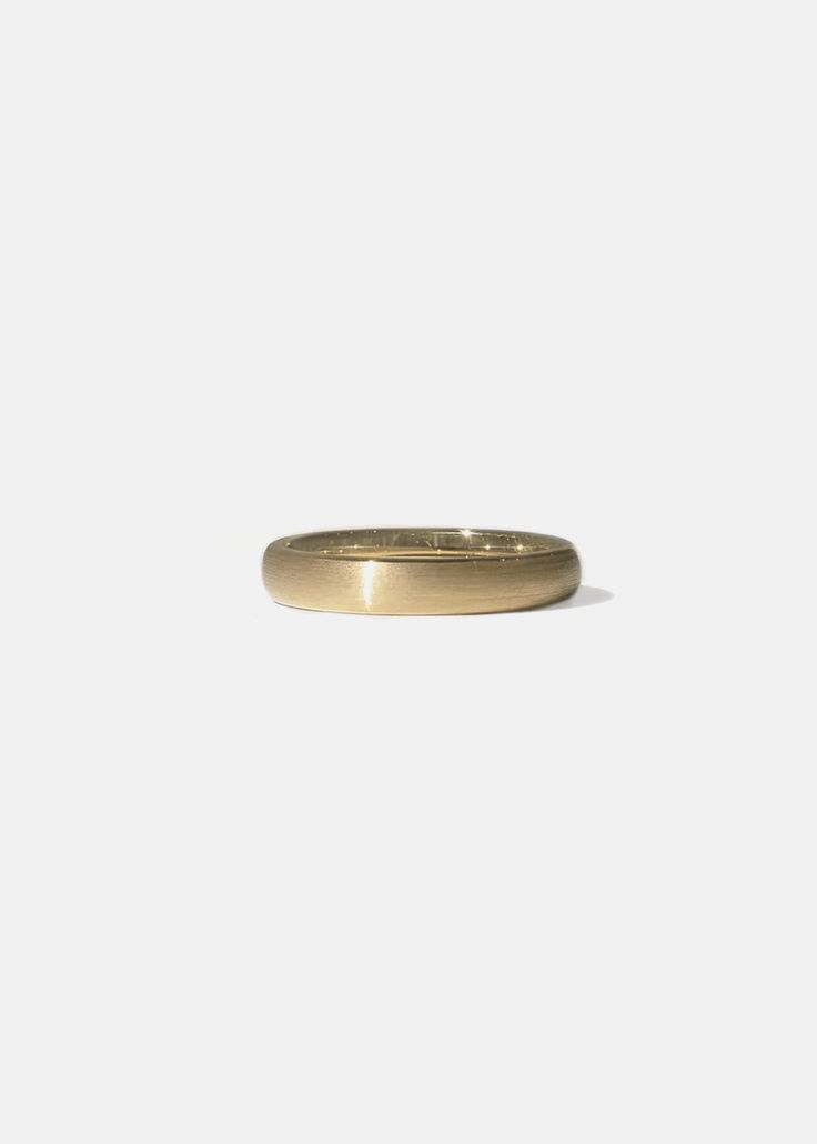 Crafted of polished 18K gold, our Giles Band showcases a soft satin finished dome that balances symmetry in the purest form. 4 mm wide Quarter sizes are available upon request. Please make a note at checkout. Custom variations can be made with alternative stone sizes. For inquires: bespoke@katkimfinejewelry.com Available in Yellow Gold, White Gold, Rose Gold and Platinum. — Handcrafted in Los Angeles, California. Timeless Formal Wedding Jewelry With Smooth Bezel, Timeless Yellow Gold Ring With Polished Finish, Elegant Wedding Dome Ring With Concave Design, Gold Dome Ring With Smooth Bezel In 14k Gold, Elegant Concave Dome Ring For Wedding, Minimalist Yellow Gold Thick Band Wedding Ring, Formal Yellow Gold Jewelry With Smooth Bezel, Modern 14k Gold Wedding Band With Thick Shape, Modern 14k Gold Thick Band For Wedding