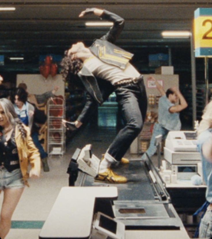 a man riding a skateboard on top of a conveyor belt in a store