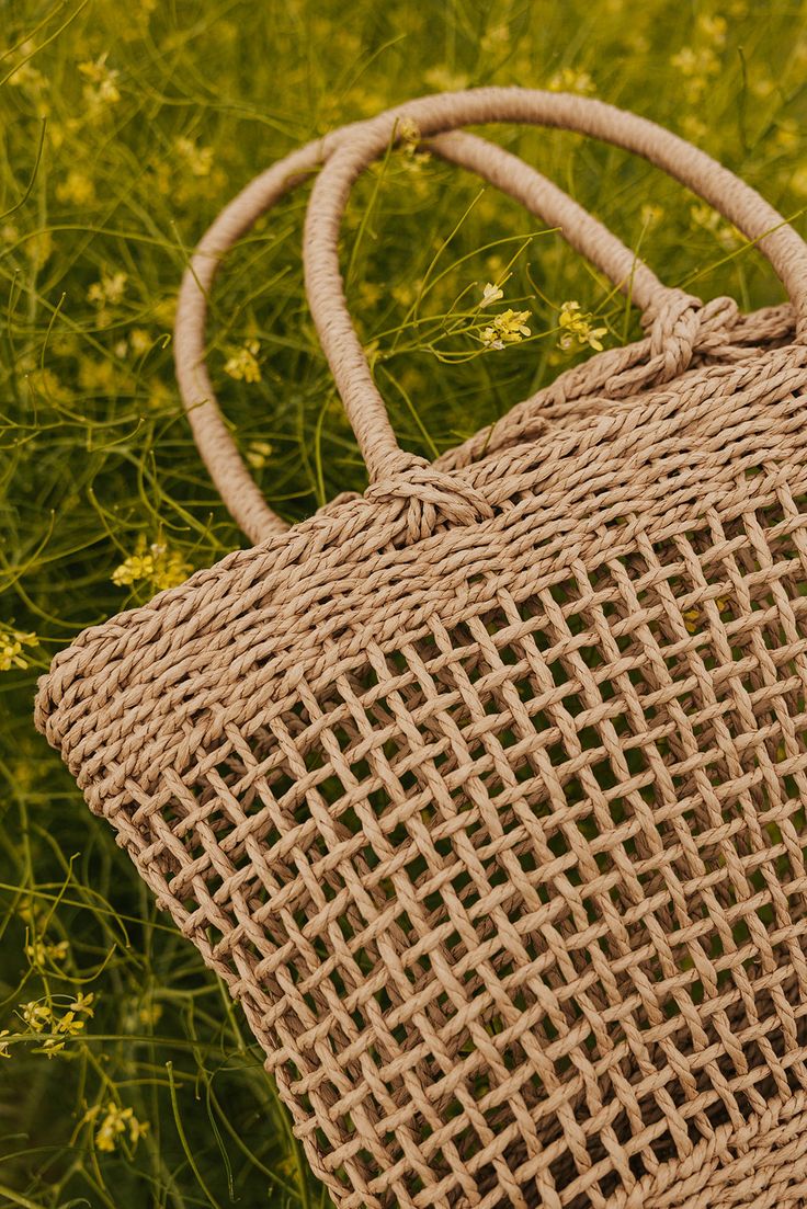 THIS SALE ITEM IS FINAL SALE! Calling all the beach babes. We introduce you to the Stop and Smell the Roses Bag. This straw bag in perfect for keeping your beach essentials at your side. This bag has should straps, a braided twine material and a waterproof feature. Width: 13 1/2" Length: 12 1/2" Stop and Smell the Roses Bag-Khaki, boutique clothing, casual, the perfect bag! Boutique Clothing Everyday Open Weave Beach Bag For Summer, Summer Everyday Open Weave Beach Bag, Trendy Braided Bag For Vacation, Trendy Braided Rectangular Bags, Beachy Bucket Bag With Braided Handles For Daily Use, Trendy Beach Bag With Braided Handles For Daily Use, Trendy Jute Beach Bag With Adjustable Strap, Everyday Beach Bag With Braided Details, Beach Bag With Braided Details For Everyday Use