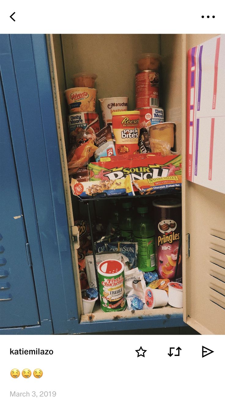 an open refrigerator with food in it and some other items on the shelf next to it