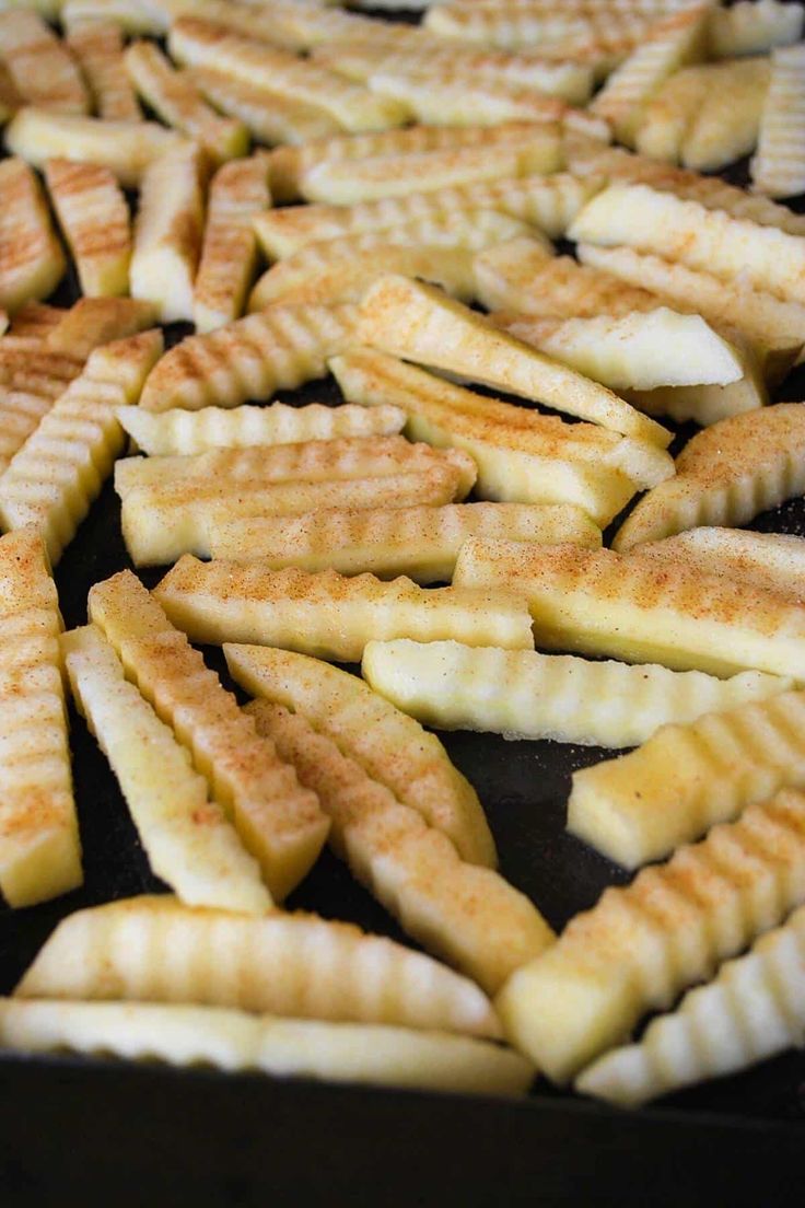 some cut up french fries sitting on top of a pan