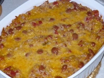 a casserole dish with cheese and pepperoni in it sitting on a table