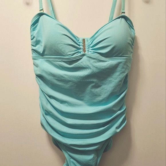 Calvin Klein One Piece Aqua Swimsuit. Can Be Worn Bandeau Style Or With Adjustable Straps. Side Ruching For A Flattering Fit. Fully Lined, Removable Cups And Moderate Coverage In The Back. Color Is A Beautiful Light Aquamarine With A Silver Calvin Klein Embellishment In The Front And A Small Silver Tag In The Back. This Is A New Swimsuit, Never Worn But Tags Were Removed. Size 12 Nwot Calvin Klein Blue Swimwear For Summer, Calvin Klein Swimwear For Swimming, Calvin Klein Swimwear For Summer Beachwear, Calvin Klein Swimwear For Summer Pool, Calvin Klein Summer Swimwear For Pool, Calvin Klein Swimwear For Summer, Calvin Klein Beachwear Swimwear For Summer, Calvin Klein Summer Poolside Swimwear, Calvin Klein Summer Beachwear Swimwear