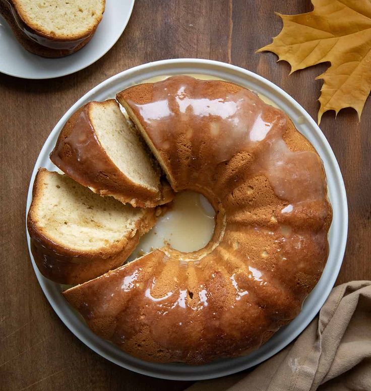 a bundt cake on a plate with slices cut out