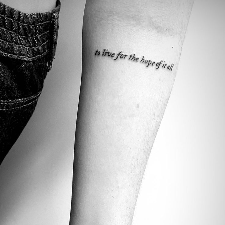 a person with a tattoo on their arm that says, to live for the hope of all