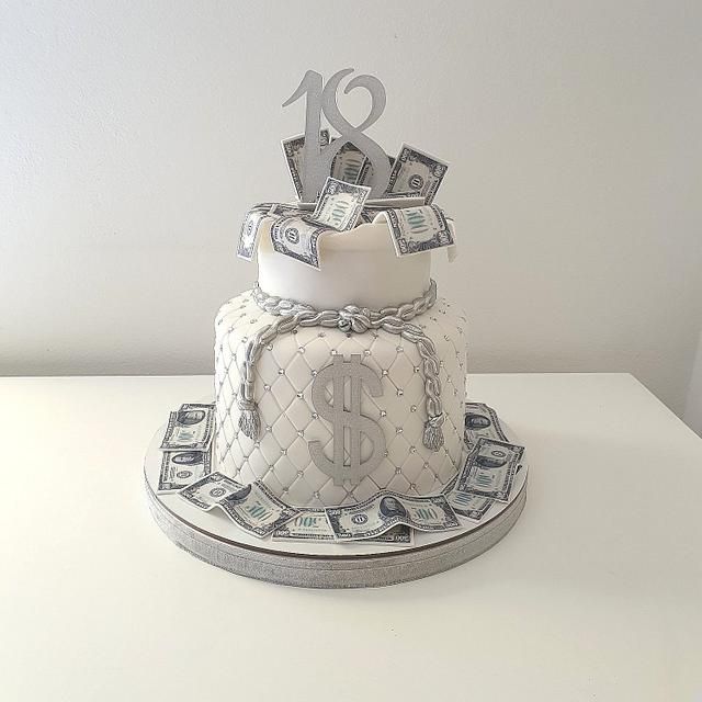 a cake made to look like it has money on top