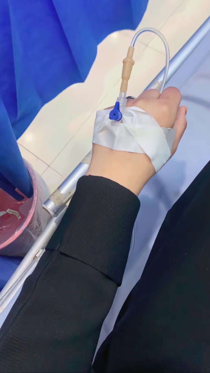 a person with an iv in their hand