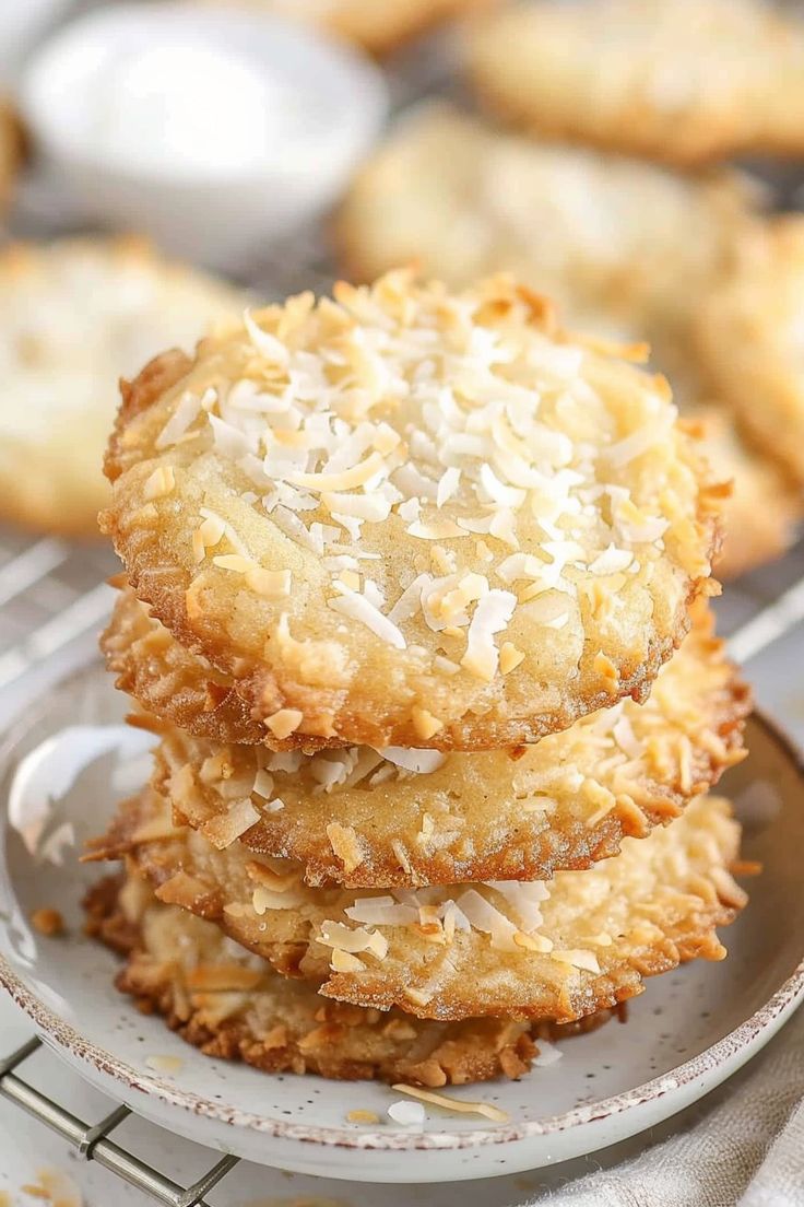 three coconut cookies stacked on top of each other