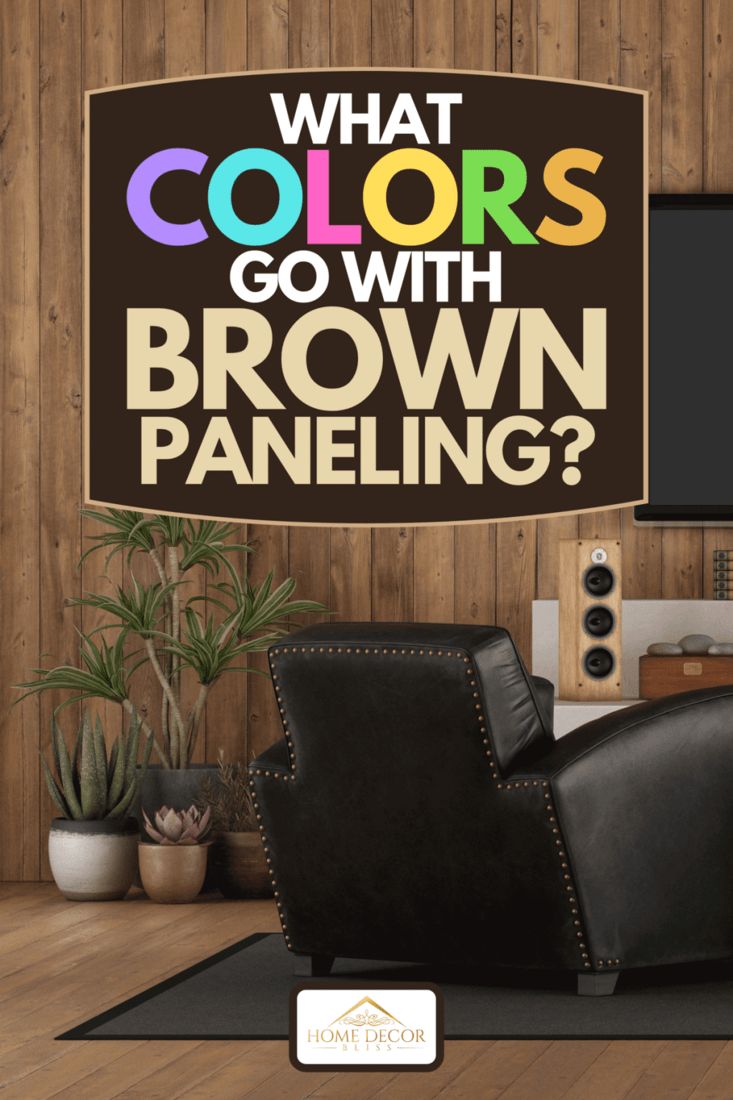 what colors go with brown paneling? in this living room, there is a black leather recliner