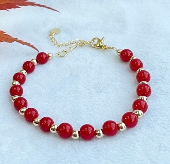 This beautiful and simple design coral red bracelet is made with 6cm bright red carol beads,  4cm 14k gold plated, and 18k gold extension. Length: 16cm with 5 cm extension.  This bracelet is ready and can be posted in 1 working day by royal mail 2nd class. It will be packed with a gift box and ready to be gifted.  More can be found:  http://www.etsy.com/uk/shop/smartsmalldesigns Red Bracelet, Red Bracelets, Coral Red, Gift Christmas, Bright Red, Uk Shop, Arm Band, Simple Design, Royal Mail