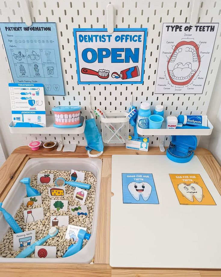 an open dental office with toys and materials on the counter top in front of it