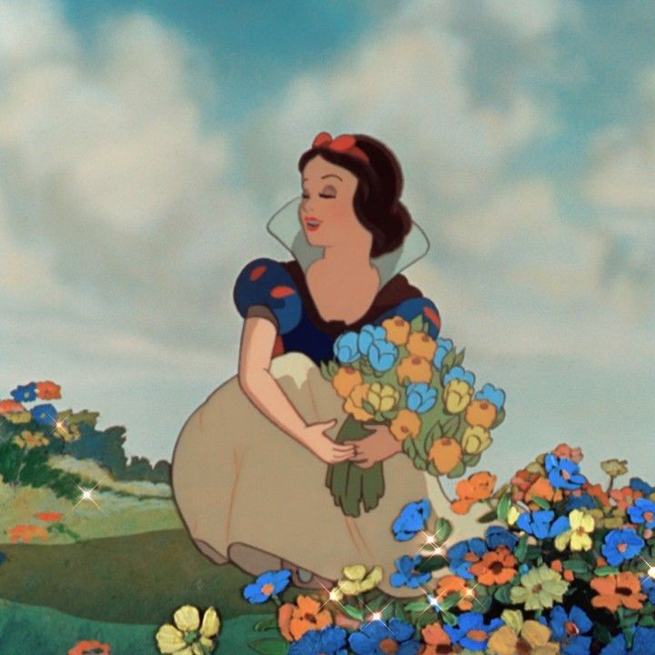 snow white holding flowers in her hands and looking at the sky with clouds behind her