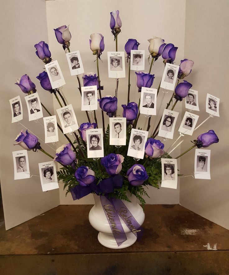 a vase filled with purple and white flowers