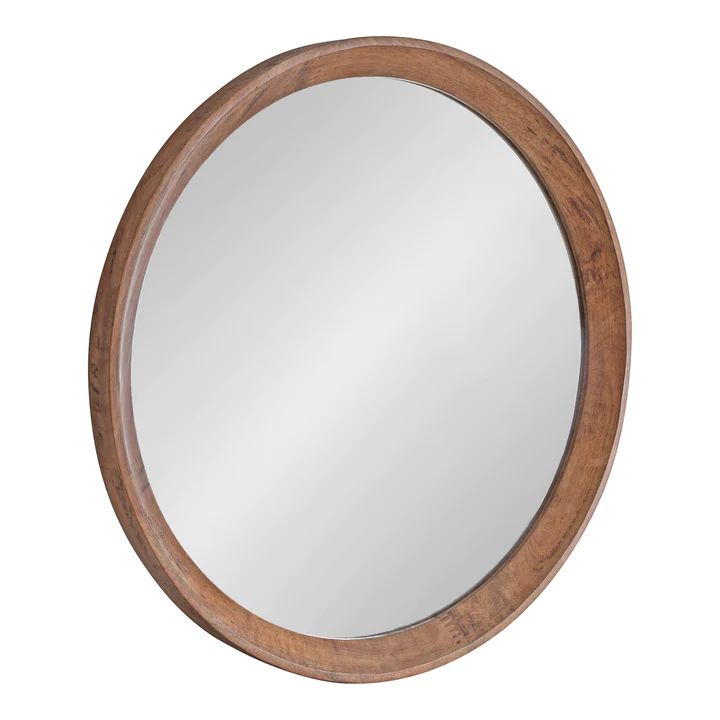 a round wooden mirror on a white background