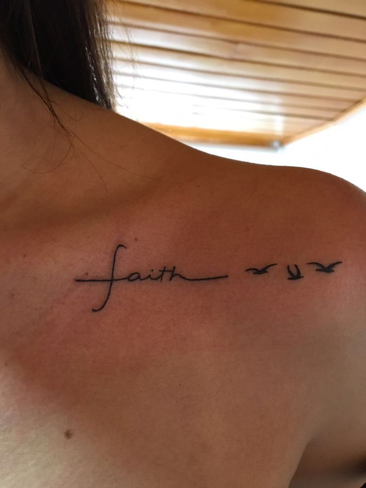 a woman with a tattoo on her shoulder that says faith and two birds flying in the sky