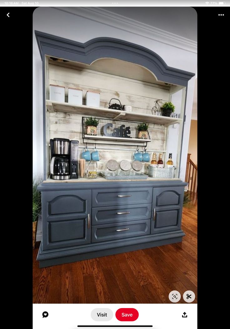 an old china cabinet is painted blue and has been turned into a coffee bar with built - in shelves