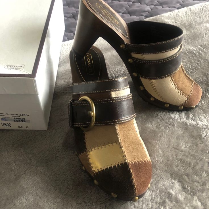 Unique Style, Original Coach Design, New With Tag, Never Used, Size 8 But Fits Smaller. Coach Casual Closed Toe Heels, Casual Coach Closed Toe Heels, Casual Closed Toe Coach Heels, Coach Leather Mules With Round Toe, Casual Coach Slip-on Mules, Casual Coach Leather Heels, Casual Leather Coach Heels, Coach Leather Slip-on Heels, Casual Brown Coach Heels