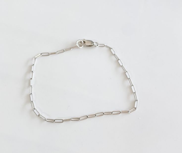 The most beautiful dainty Jenni mini silver paperclip chain! sterling silver Everyday Dainty White Gold Chain Bracelet, Dainty White Gold Chain Bracelet For Everyday, Sterling Silver Paperclip Jewelry For Everyday, Minimalist Jewelry With Sterling Silver Paperclip Clasp, Classic Sterling Silver Paperclip Bracelet With Box Chain, Silver Chain Link Paperclip Bracelet For Everyday, Gift White Gold Sterling Silver Cable Chain Bracelet, Silver Paperclip Jewelry For Everyday Wear, Minimalist Sterling Silver Paperclip Jewelry