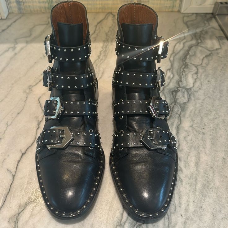 Black Studded Boot Excellent Condition Chic Black Studded Moto Boots, Chic Black Moto Boots With Studs, Designer Black Boots With Buckle Closure, Designer Black Moto Boots For Fall, Designer Black Moto Boots With Buckle, Designer Black Moto Boots With Buckle Closure, Givenchy Boots, Givenchy Shoes, Studded Boots