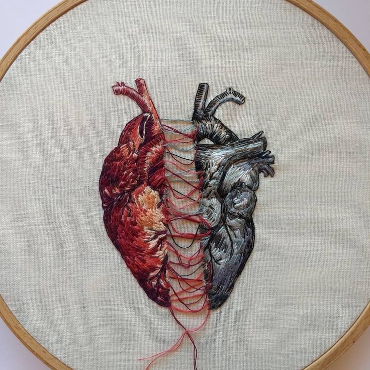 a cross stitch heart with two different colors