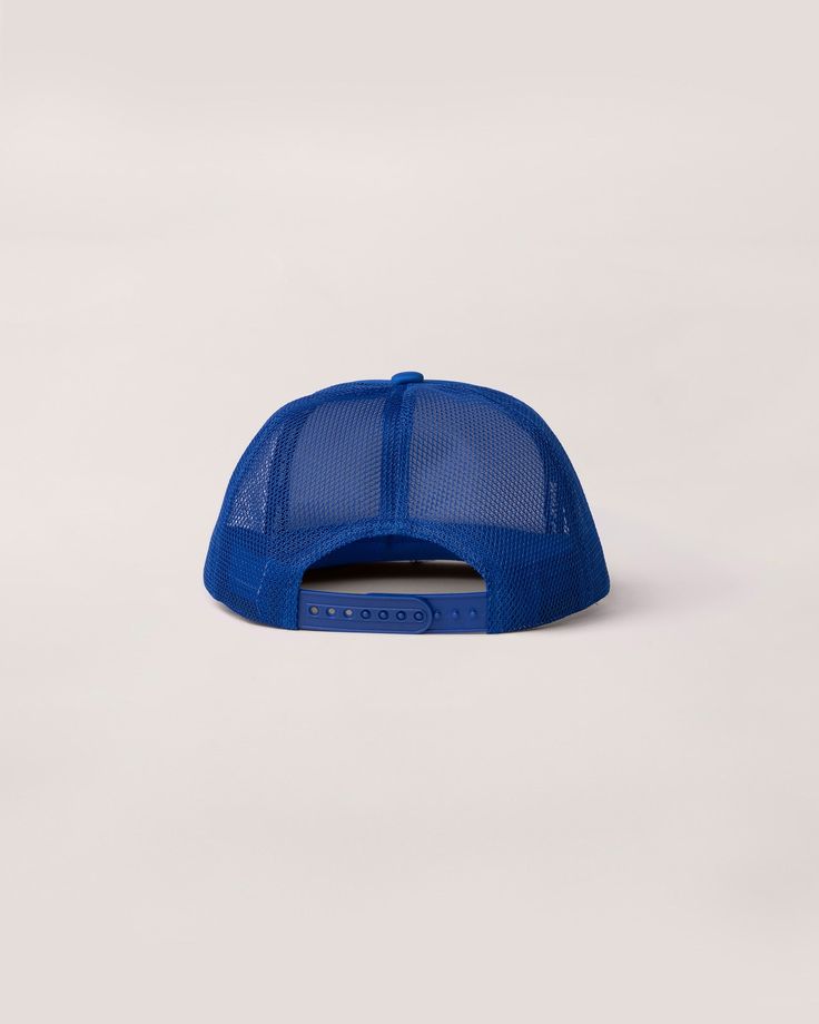 Keep the sun out of your eyes and all eyes on you with this loud, proud puff-print trucker. It’s the original shademaker carefully constructed to keep a high profile. So keep your head cool and your look fire with this flat-billed beauty. Blue Trucker Cap With Flat Brim, Adjustable Blue Trucker Hat With Curved Bill, Blue Flat Brim Trucker Hat For Streetwear, Blue Flat Brim Trucker Hat, Blue Adjustable Trucker Hat With Curved Bill, Cheap Blue Trucker Hat For Streetwear, Trendy Blue Trucker Hat, Blue Cap With Uv Protection, Fun Blue Trucker Hat For Outdoor