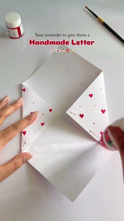 someone is making a handmade letter for valentine's day