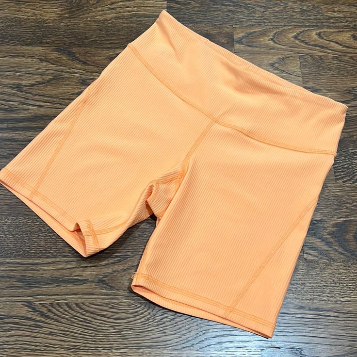 Super Cool Bright Orange Ribbed Biker Shorts With One Waist Pocket. Tried On Never Worn In New Condition. Casual Compression Shorts For Spring, Casual Orange Yoga Shorts, Orange Workout Bottoms With Built-in Shorts, Workout Bottoms With Built-in Shorts In Orange, Athleisure Orange Short Bottoms, Athleisure Short Orange Bottoms, Orange Short Athleisure Bottoms, Orange Athleisure Shorts, Casual Orange Biker Shorts