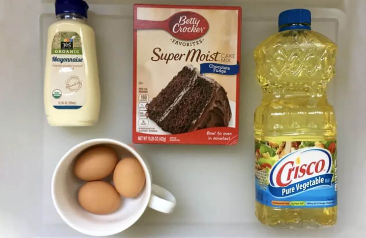 eggs, yogurt, milk, and chocolate cake on a tray