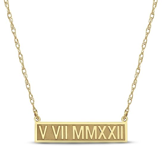 This chic Roman numeral bar necklace is perfect for commemorating a special day. Crafted in 14K yellow gold, the bar pendant features a high polish finish and is customized with a date of your choosing. The pendant suspends from an 18-inch rope chain that secures with a spring ring clasp. Classic Gold Nameplate Bar Necklace, Customizable Gold Bar Necklace For Anniversary, Classic Yellow Gold Bar Necklace For Anniversary, Roman Numeral, Bar Pendant, Accessories Jewelry Necklace, Roman Numerals, Rope Chain, The Bar