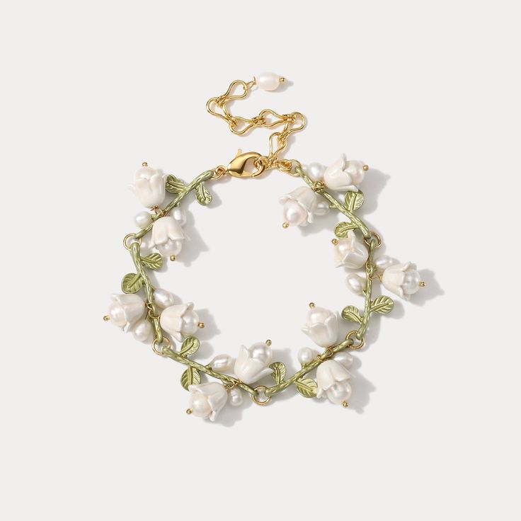 Experience the timeless elegance of the Lily of the Valley Bracelet. Crafted from 18k gold, this exquisite piece is perfect for adding a touch of sophistication and luxury to any look. Leave your mark with an accessory that you won't find anywhere else. DETAILS Plating: 18K Gold Materials: 18K Gold on Brass, Freshwater Elegant Flower Bracelets For Formal Occasions, Delicate Floral Bracelet For Formal Occasions, Lily Of The Valley Bracelet, Delicate Bracelet Jewelry As Gift For Her, Delicate Bracelet Jewelry Gift For Her, Elegant Adjustable Flower Bracelet, Elegant Bangle Bracelet As A Gift For Her, Adjustable Flower Bracelets For Formal Occasions, Formal Adjustable Flower Bracelets