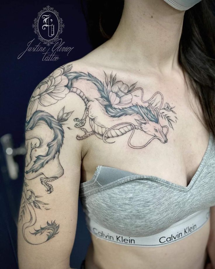 a woman with a dragon tattoo on her chest