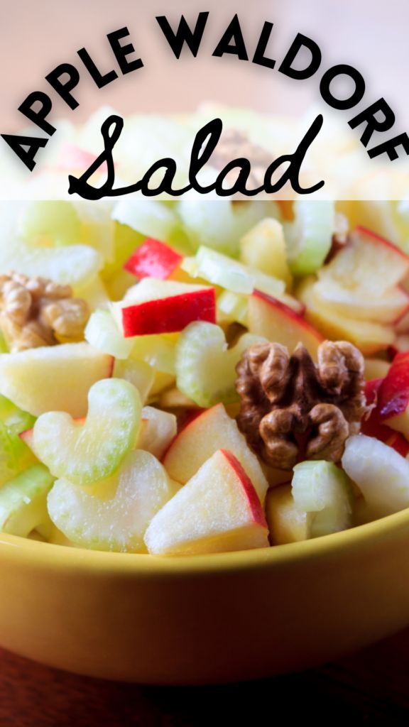 an apple salad in a yellow bowl with walnuts and apples