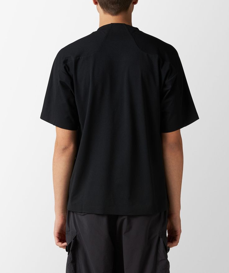 This black technical T-shirt by and wander bears reflective details on the front pocket, to ensure you hike safely and securely. Black Technical T-shirt For Outdoor, Black Crew Neck T-shirt With Side Pockets, Black Crew Neck T-shirt For Outdoor Activities, Black Crew Neck T-shirt For Outdoor, Black Sporty T-shirt For Outdoor Activities, Black Short Sleeve T-shirt For Hiking, Technical Black Tops For Outdoor Activities, Technical Black Top For Outdoor, Black Short Sleeve T-shirt With Side Pockets