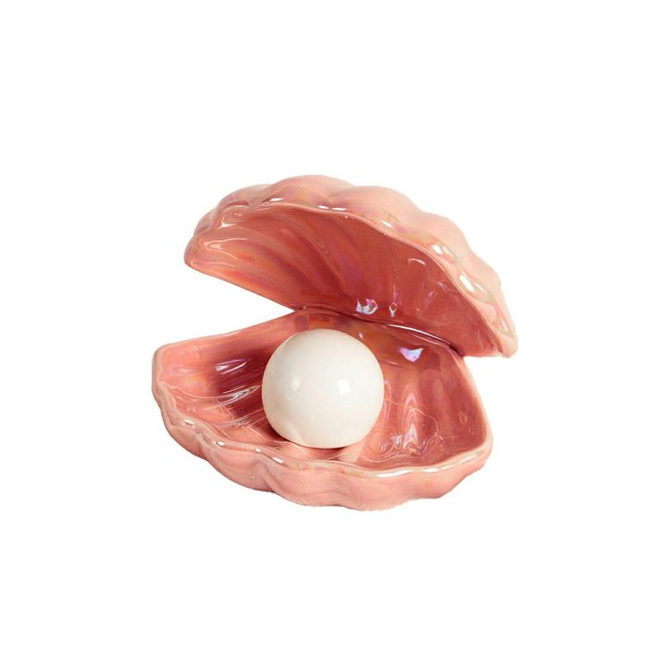 an egg in the middle of a piece of meat with it's shell open