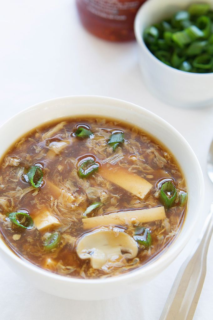 a white bowl filled with soup and vegetables