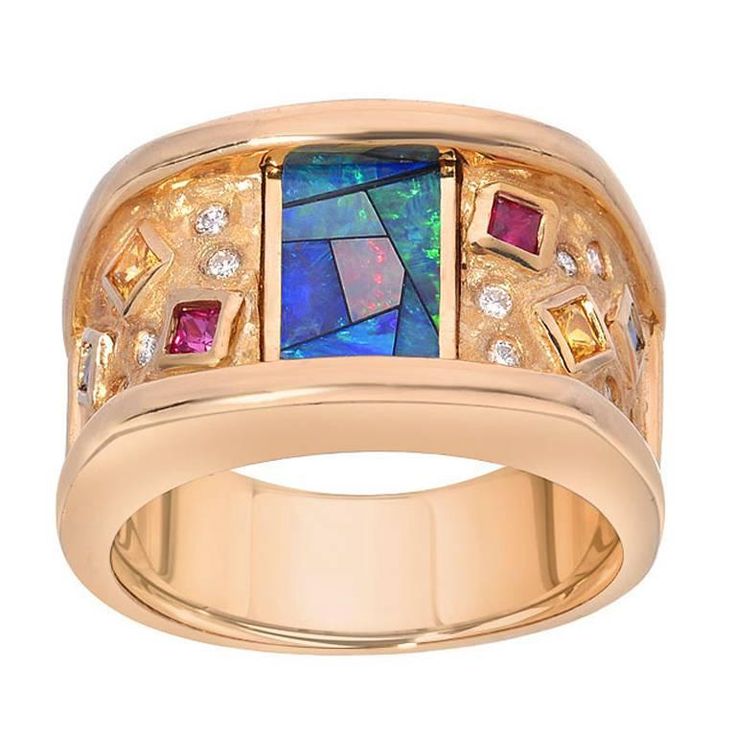 This unique estate ring features a mosaic of inlay opal which is accented by diamonds, rubies, yellow sapphire and blue sapphire, all set in 18K yellow gold. Currently ring size 6.75 Rose Gold Wedding Ring Sets, Sapphire Gold Ring, White Gold Engagement Rings Vintage, Ruby Ring Gold, Blue Diamond Ring, Yellow Gold Diamond Ring, Moonstone Engagement, Moonstone Engagement Ring, Engagement Ring White Gold