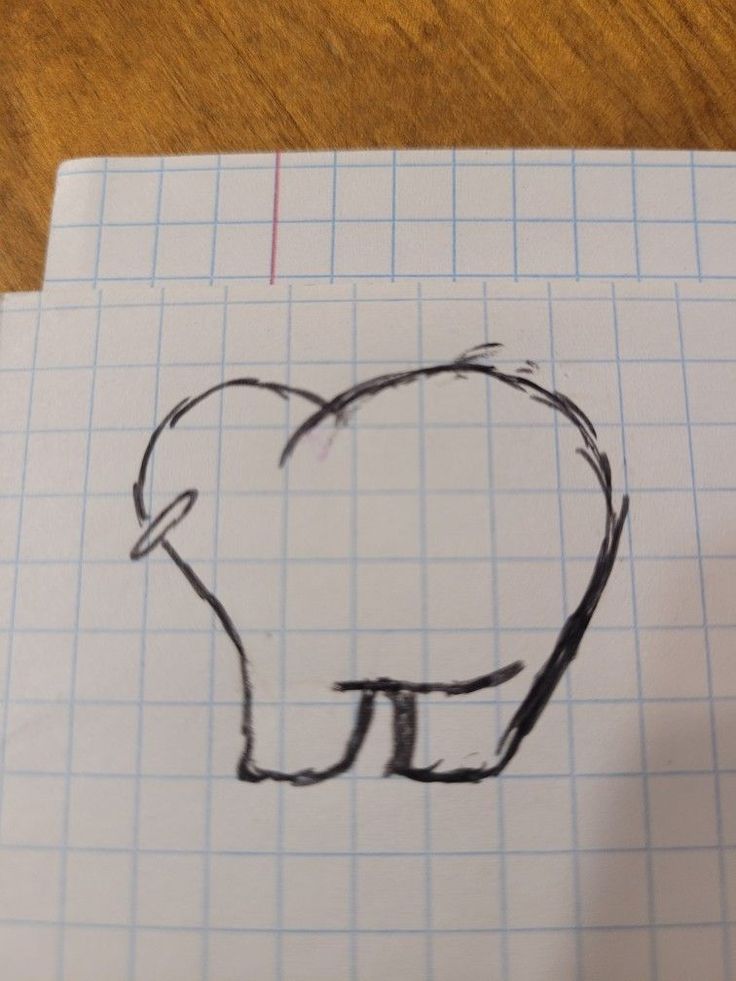 a drawing of a tooth on top of a piece of paper