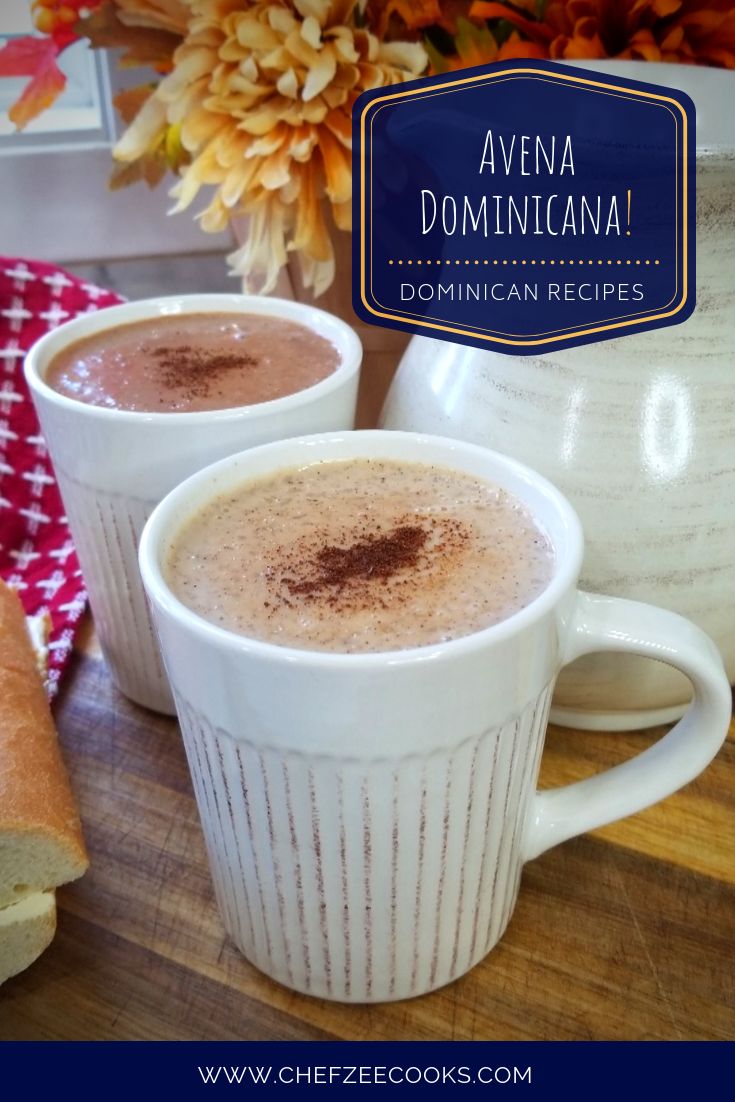 two white mugs filled with hot chocolate on top of a wooden table