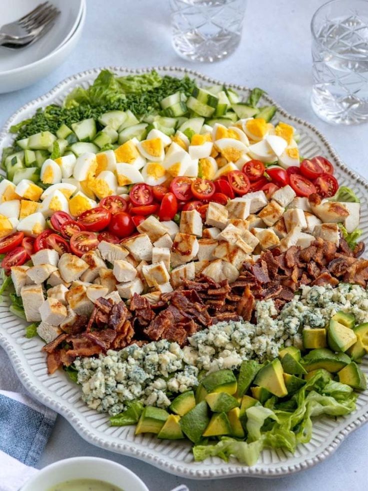 a platter filled with different types of salads