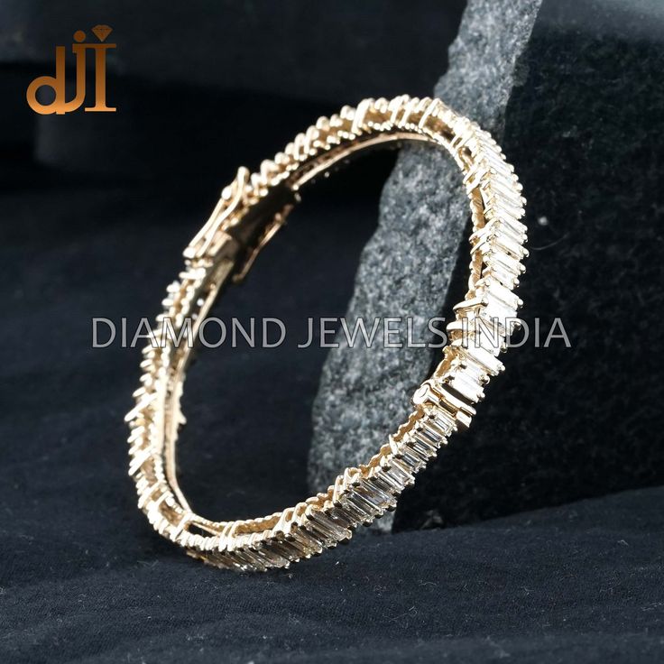 Baguette Diamond Solid 14k Yellow Gold Handmade Oval Bangle Jewelry BAMJ-199 Baguette Diamond Bangle. 14k Gold Bangle Jewelry. 14k Yellow Gold Jewelry. Handcrafted Diamond Bangle. Diamond Oval Bangle. Champagne White Diamond.  45x60 MM Bangle Size. Here Are Some Amazing Ways To Take Care Of Your Precious Diamond Jewelry. Always. * Apply lotion, cosmetics, hairspray, and perfume before dressing in jewelry. * When undressing, wipe each piece with a clean soft cloth to remove oils and perspiration. * Store in a fabric-lined box, separately or individually-wrapped in tissue to prevent scratches. Never: * Never wear jewelry when doing physical work such as housekeeping, gardening, or exercise. * Never expose jewelry or household cleaning products. * Never expose jewelry to chlorine swimming poo Gold Bangle With Baguette Diamonds, Wedding Diamond Baguette Bracelet With 17 Jewels, Fine Jewelry Bangle With Baguette Diamonds For Gift, Wedding Baguette Diamond Bracelet With 17 Jewels, Baguette Cut Diamond Bracelets, Yellow Gold Diamond Bangle With Baguette Diamonds, 14k Gold Diamond Bracelet With Baguette Diamonds For Anniversary, Baguette Diamond Bangle For Anniversary, Anniversary Bracelets With Baguette Cut Single Diamonds